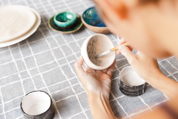 Person Painting Pottery