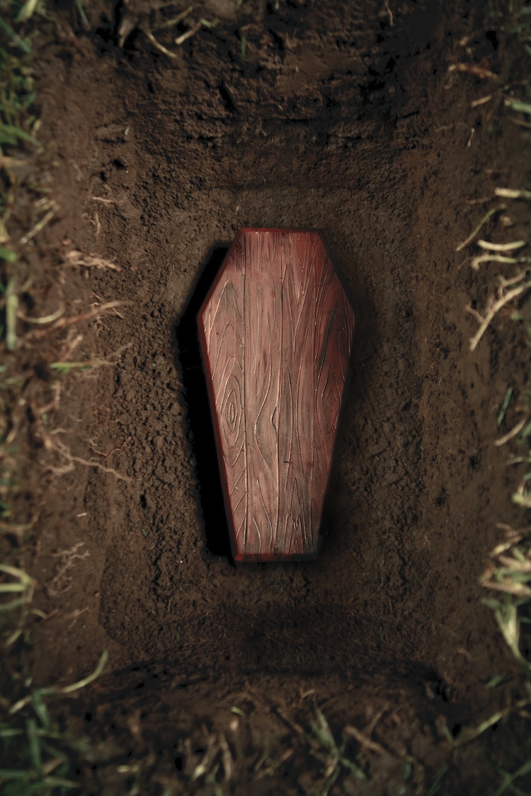 Wood coffin in a grave
